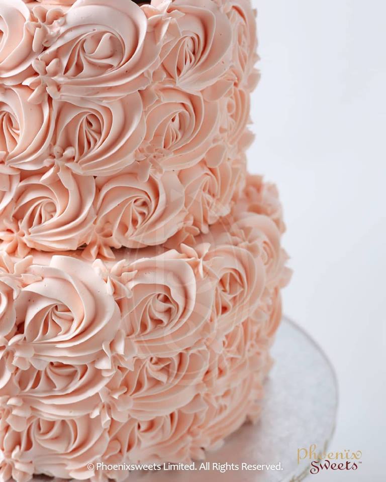 Top of our multi color rose swirl cake 🎂 - Sugar Dot Bake Shop | Facebook